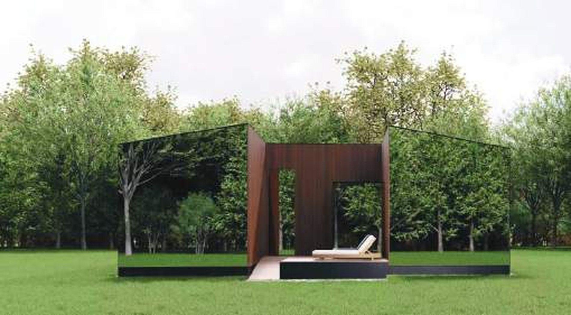 A villa at dusk, charred timber against the bush